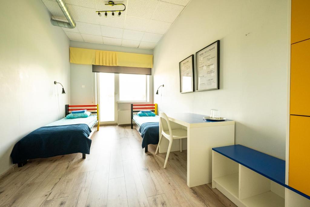 Postel nebo postele na pokoji v ubytování Tamme staadioni hostel