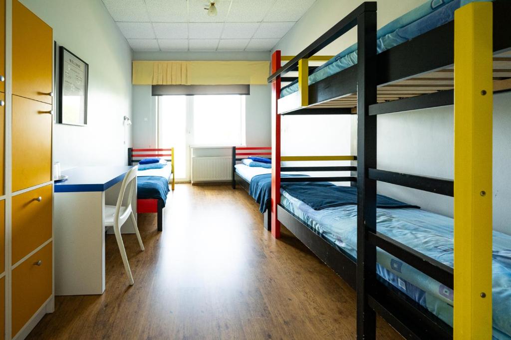 Postel nebo postele na pokoji v ubytování Tamme staadioni hostel