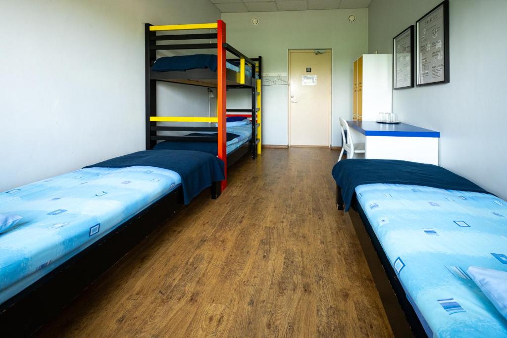 Postel nebo postele na pokoji v ubytování Tamme staadioni hostel