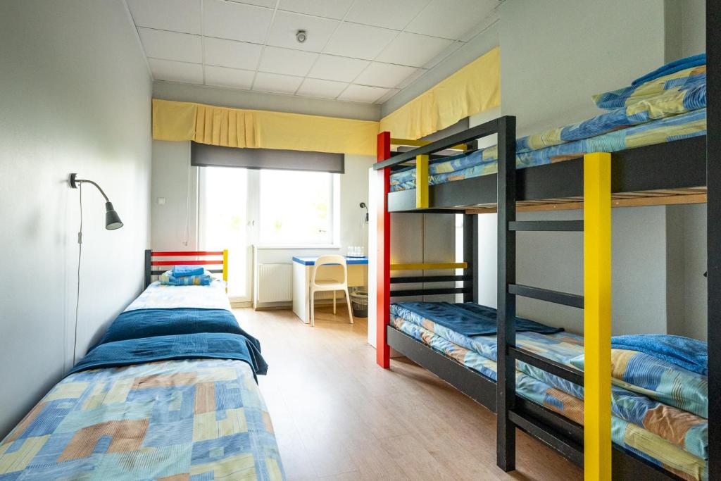 Postel nebo postele na pokoji v ubytování Tamme staadioni hostel