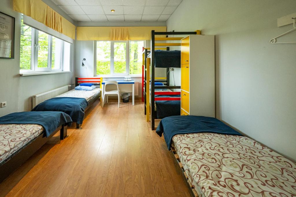 Postel nebo postele na pokoji v ubytování Tamme staadioni hostel