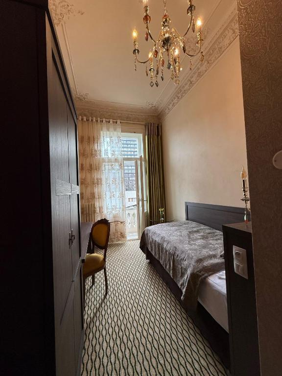 Postel nebo postele na pokoji v ubytování Hotel Rudolf II Karlovy Vary