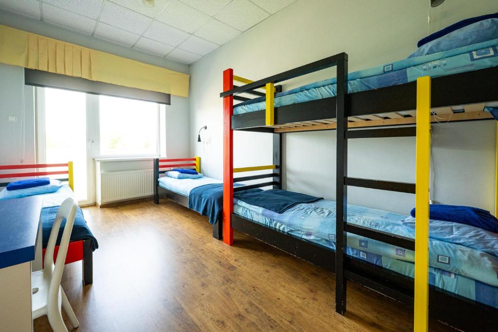 Postel nebo postele na pokoji v ubytování Tamme staadioni hostel