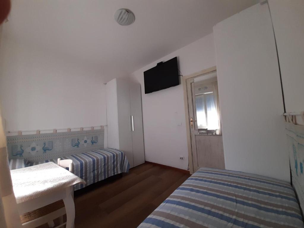Postel nebo postele na pokoji v ubytování La Pervinca
