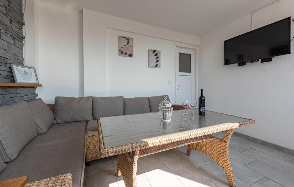 a living room with a couch and a table at 1 Bedroom Gorgeous Apartment In Pag in Pag