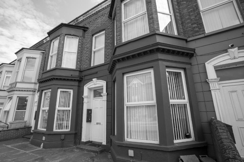 a black and white photo of a house at Glenmore Lodge in Belfast