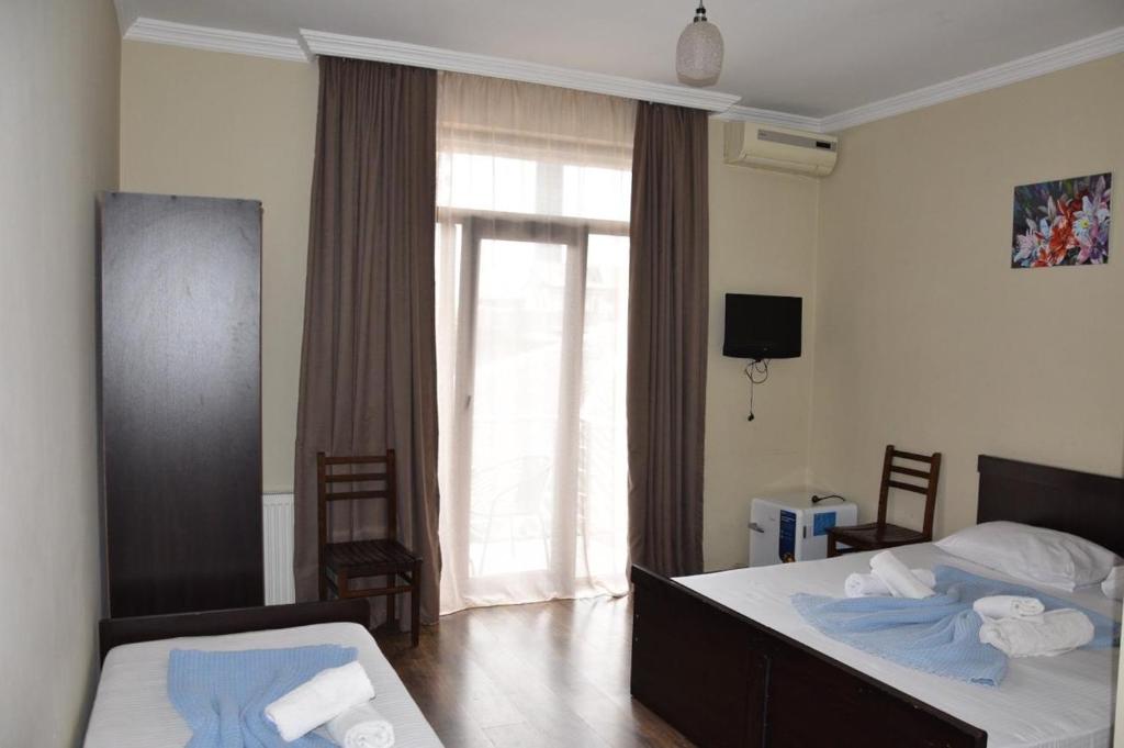 Postel nebo postele na pokoji v ubytování Hotel Sunny Coast