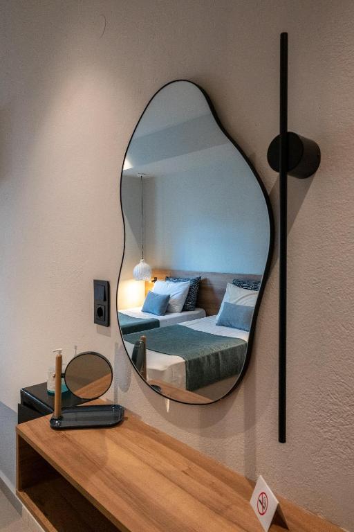 Postel nebo postele na pokoji v ubytování Psaras Apartments