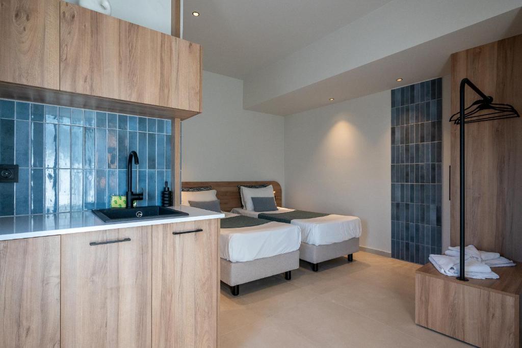 Postel nebo postele na pokoji v ubytování Psaras Apartments