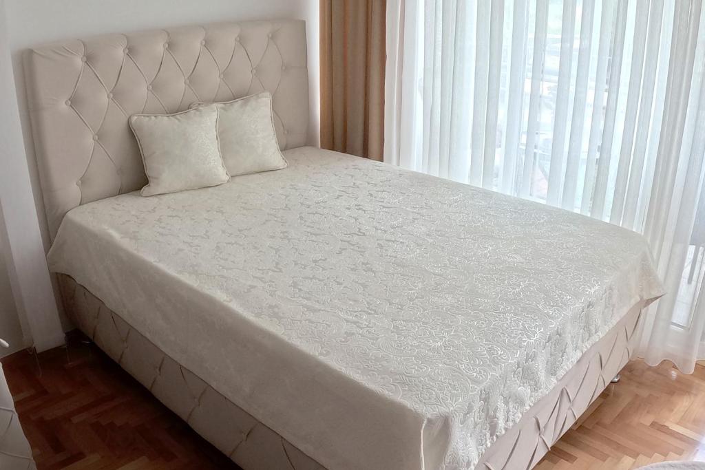Postel nebo postele na pokoji v ubytování Apartman Nini