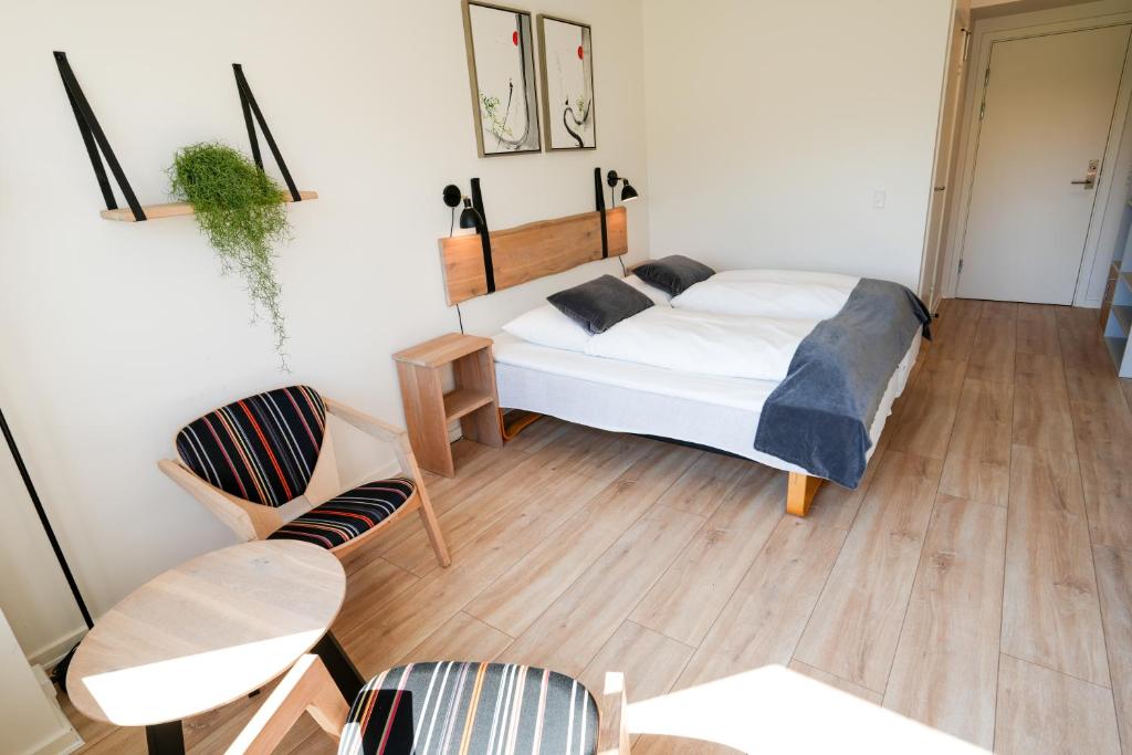 Ένα ή περισσότερα κρεβάτια σε δωμάτιο στο Hotel Vissenbjerg Storkro
