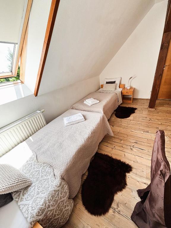 Postel nebo postele na pokoji v ubytování Wellness hotel & minipivovar Kněžínek