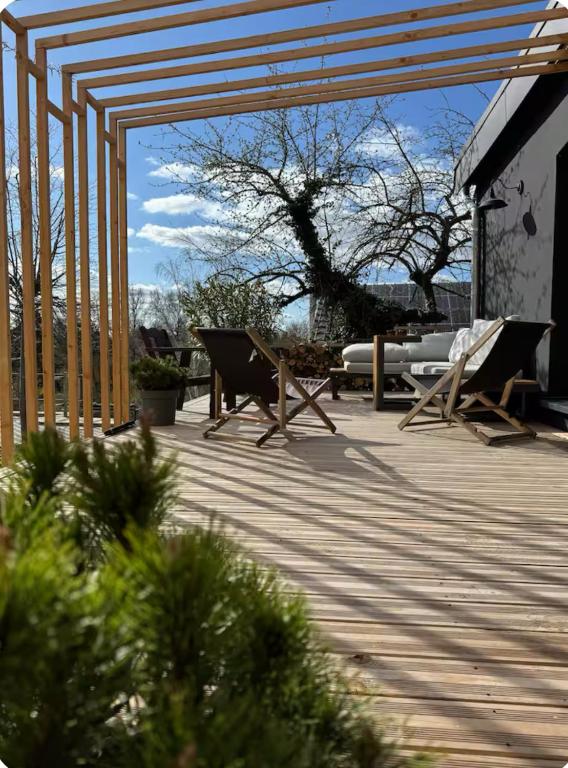 a patio with chairs at Garden Apartment in Buttelstedt