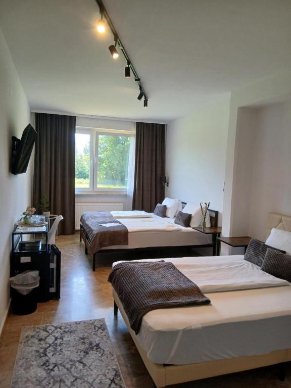 Voodi või voodid majutusasutuse Hotel Fuchs & Hase SELF CHECK IN toas
