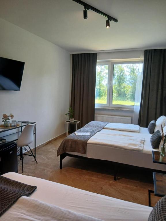 Voodi või voodid majutusasutuse Hotel Fuchs & Hase SELF CHECK IN toas