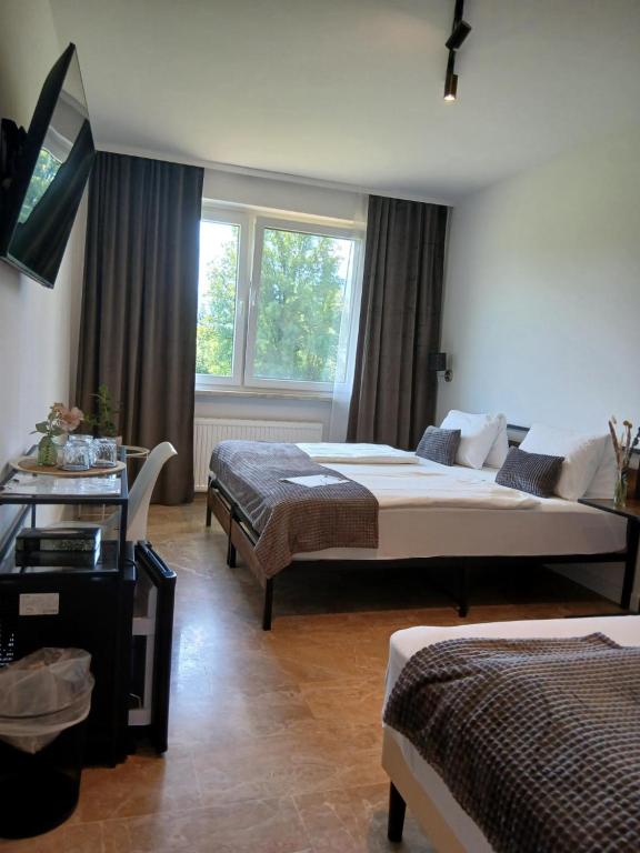Voodi või voodid majutusasutuse Hotel Fuchs & Hase SELF CHECK IN toas
