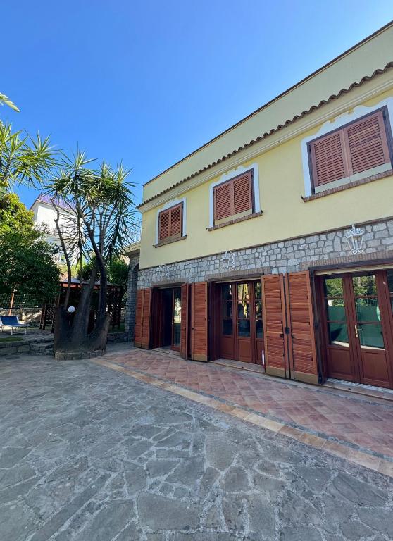 a building with a brick driveway in front of it at Casa della Riviera Sorrento in Sorrento