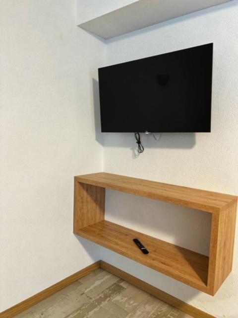 Televízia a/alebo spoločenská miestnosť v ubytovaní Residence Raethia tra Bormio e Livigno