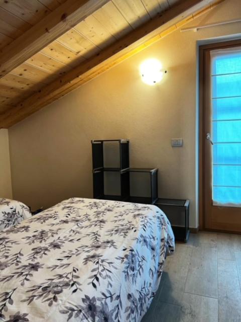 Posteľ alebo postele v izbe v ubytovaní Residence Raethia tra Bormio e Livigno