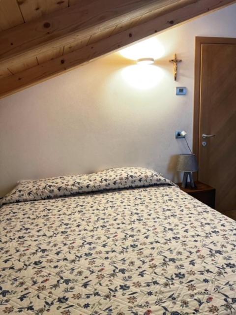Posteľ alebo postele v izbe v ubytovaní Residence Raethia tra Bormio e Livigno