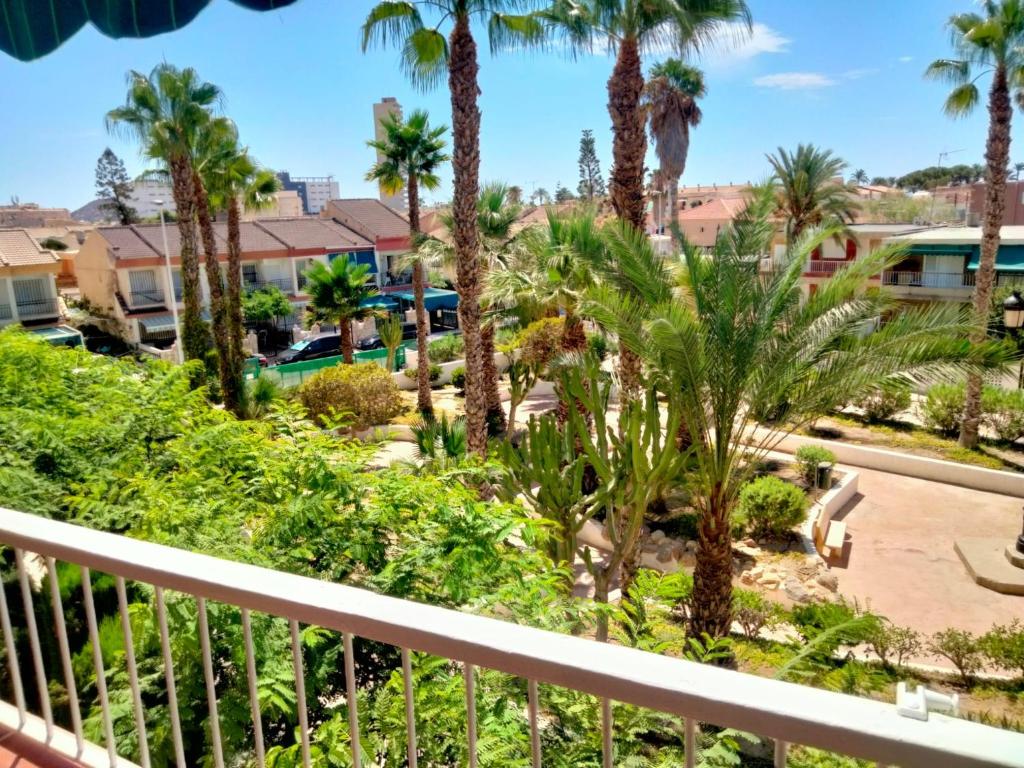 a view from the balcony of a resort with palm trees at La Reya in Puerto de Mazarrón