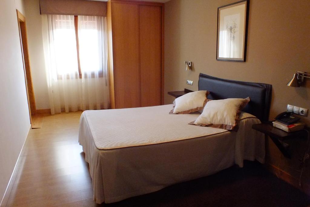 Postel nebo postele na pokoji v ubytování Hotel Rural Izar Ondo