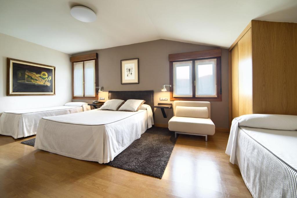 Postel nebo postele na pokoji v ubytování Hotel Rural Izar Ondo