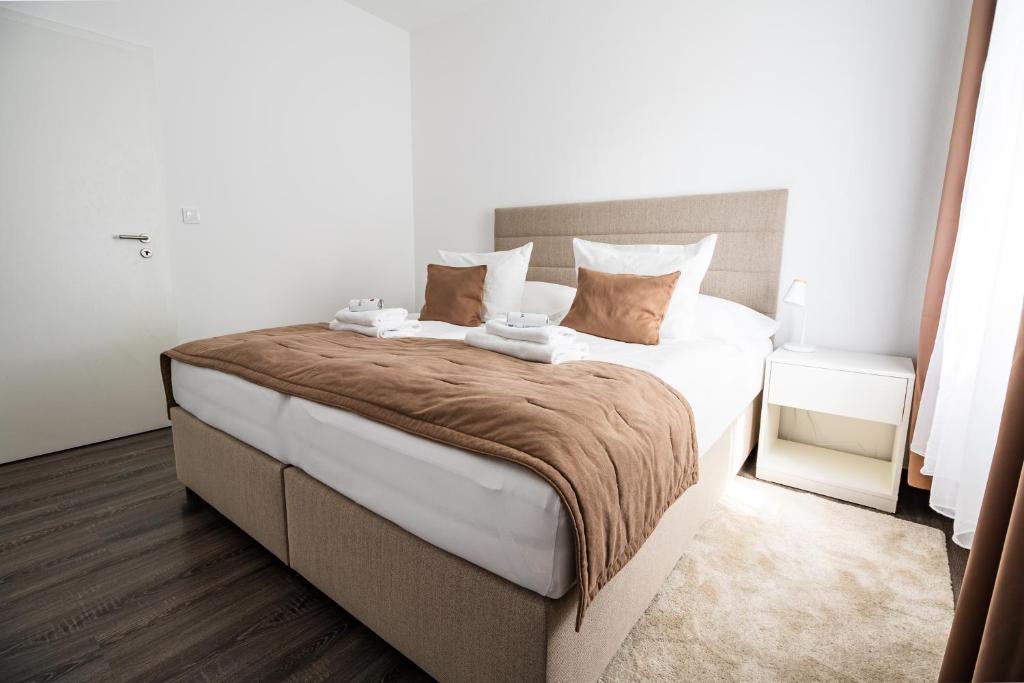 Postel nebo postele na pokoji v ubytování Hotel Vila Viola