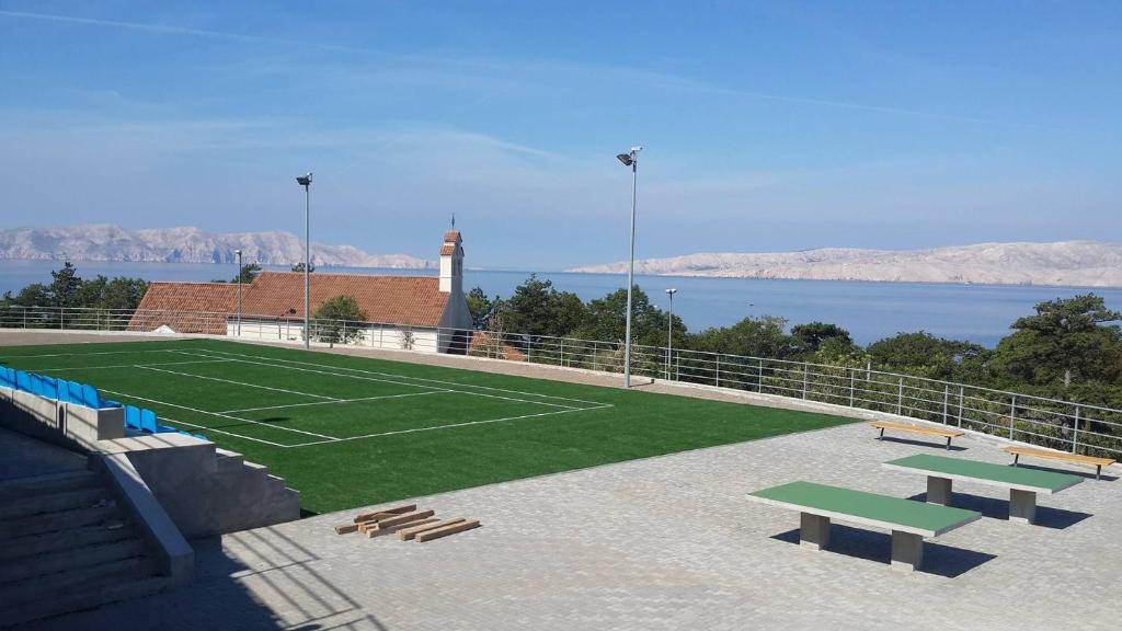 a tennis court with a tennis court at Jasmina in Senj