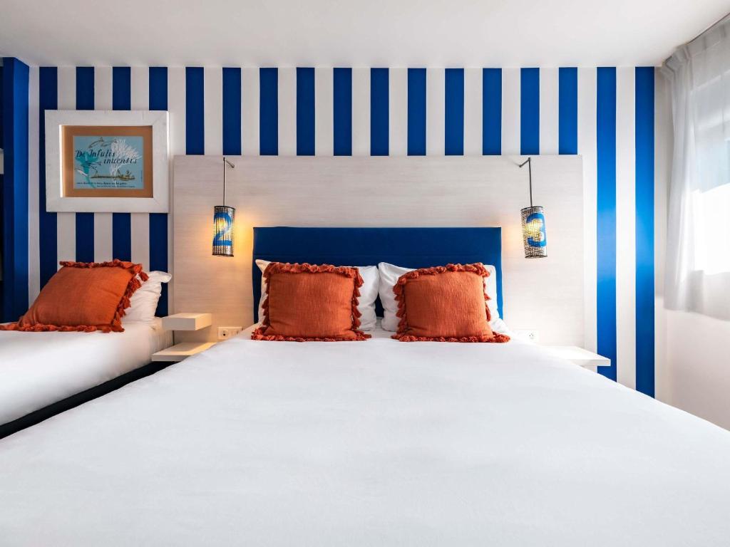 Postel nebo postele na pokoji v ubytování ibis Styles Quiberon Centre