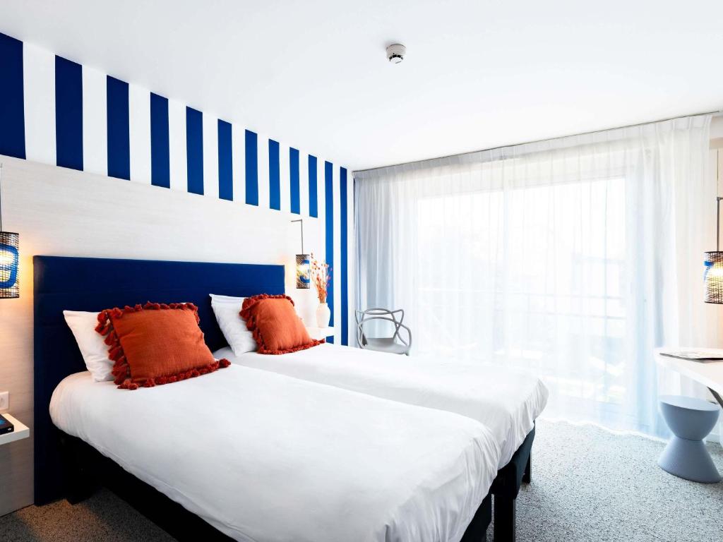 Postel nebo postele na pokoji v ubytování ibis Styles Quiberon Centre