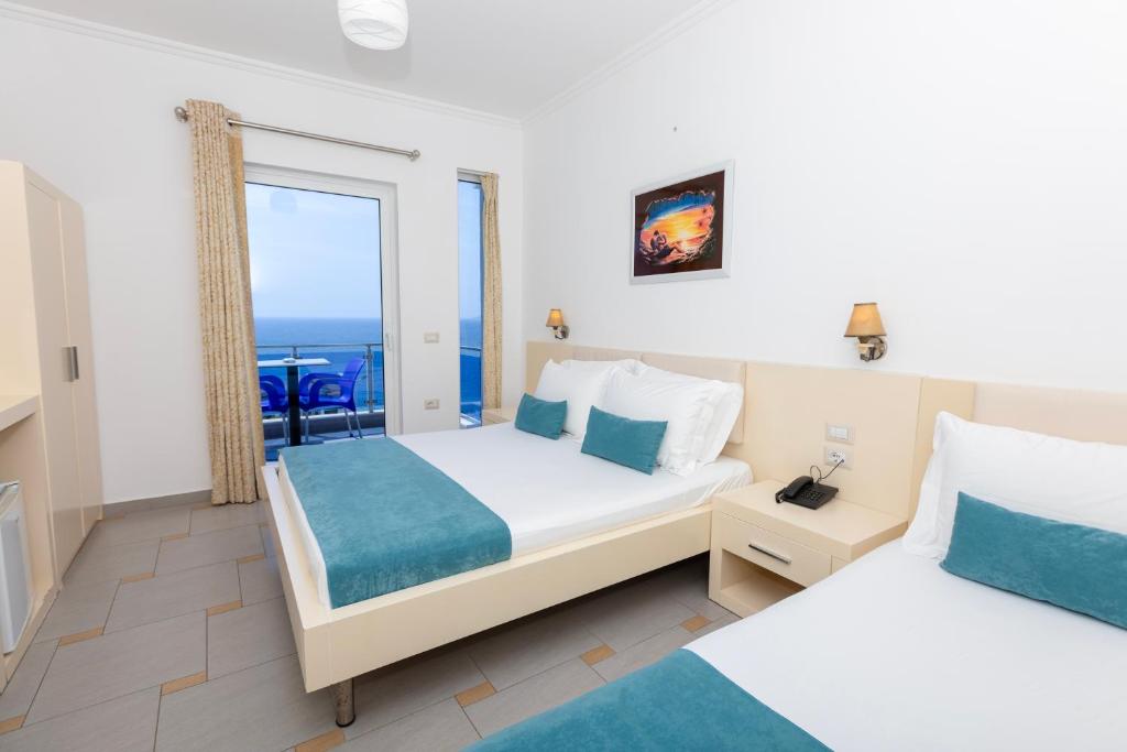 Postel nebo postele na pokoji v ubytování Hotel AGEL