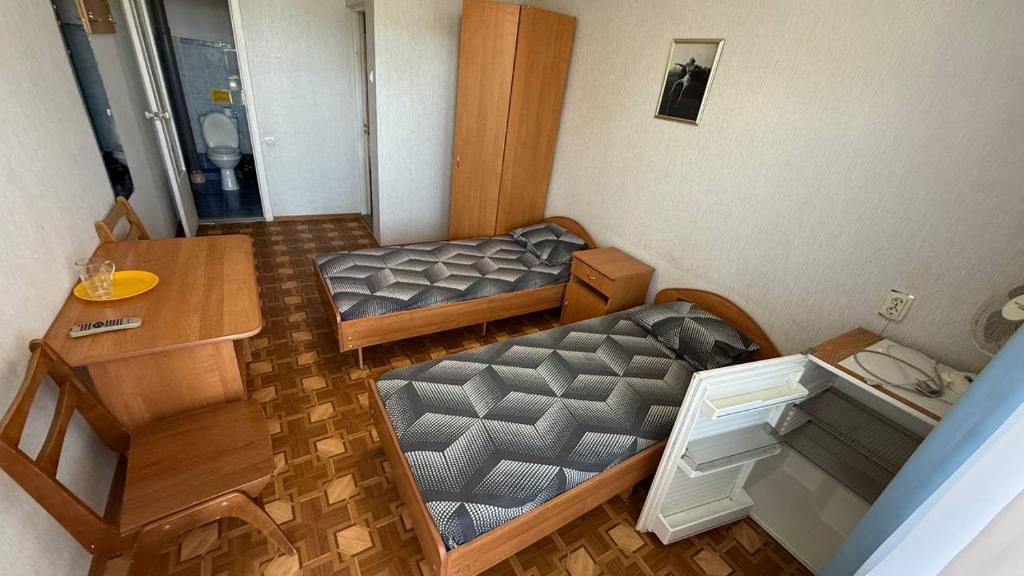 Postel nebo postele na pokoji v ubytování Ассоль