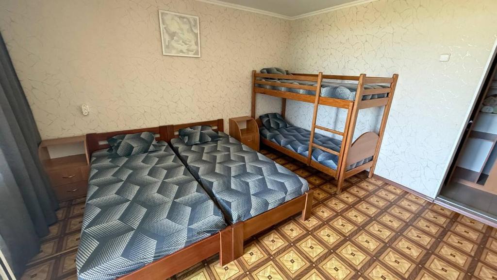 Postel nebo postele na pokoji v ubytování Ассоль