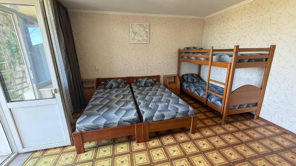 Postel nebo postele na pokoji v ubytování Ассоль