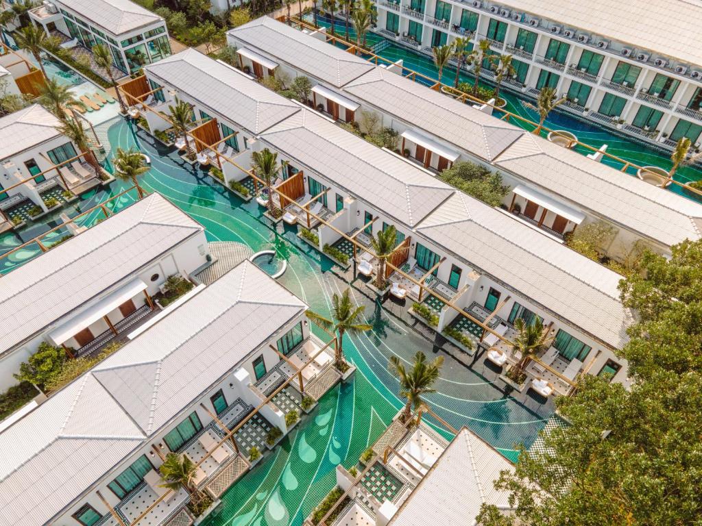 an overhead view of a resort with a pool at Sugar Marina Resort-LAGOON-Villas, Naiyang Beach in Nai Yang Beach