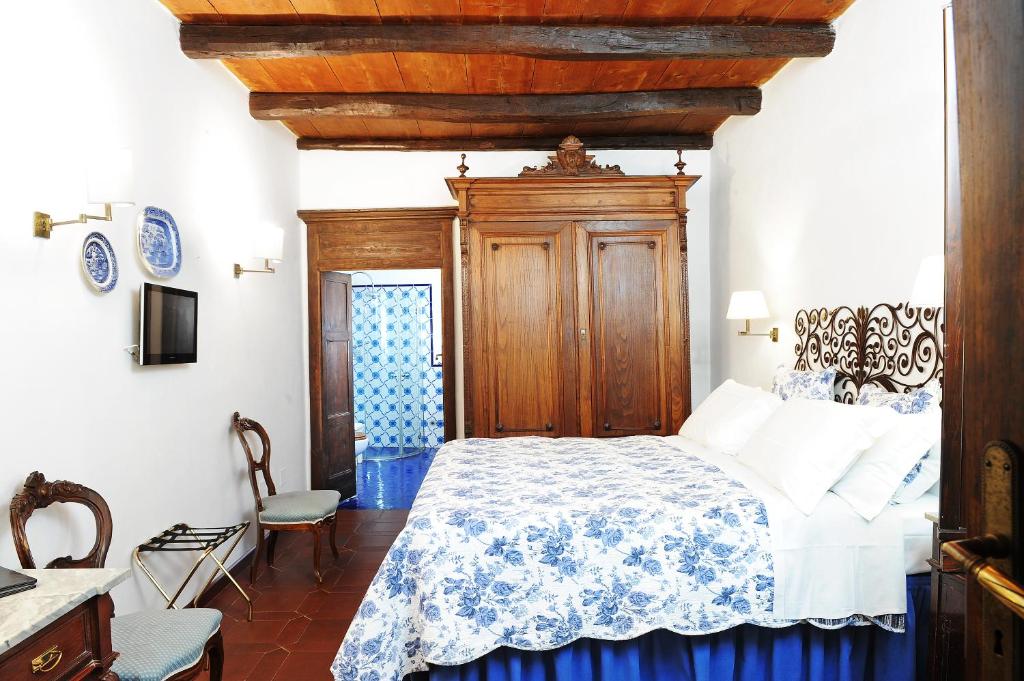 Postel nebo postele na pokoji v ubytování Hotel Lucrezia