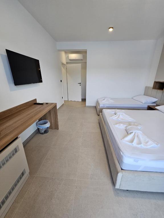 Postel nebo postele na pokoji v ubytování Apartmani Leženić M