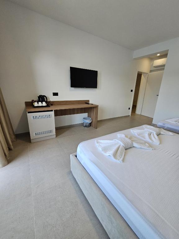 Postel nebo postele na pokoji v ubytování Apartmani Leženić M