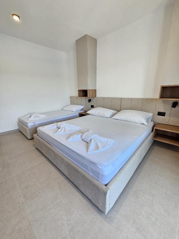 Postel nebo postele na pokoji v ubytování Apartmani Leženić M
