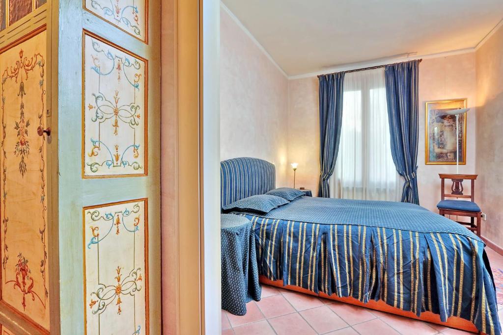 Posteľ alebo postele v izbe v ubytovaní Charmsuite Palladio