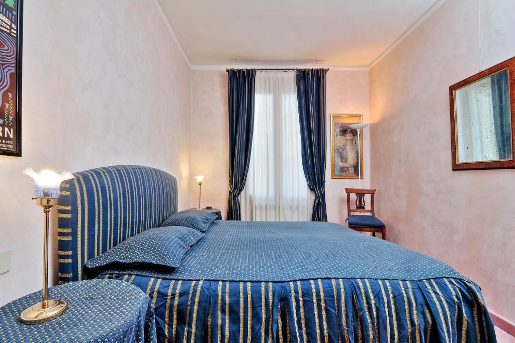 Posteľ alebo postele v izbe v ubytovaní Charmsuite Palladio