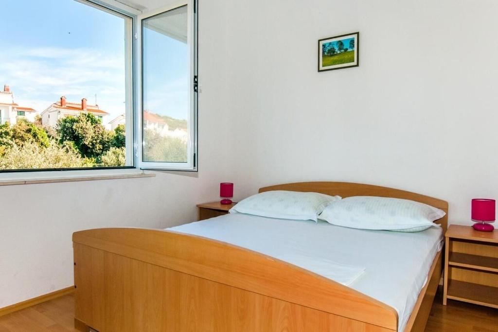 Posteľ alebo postele v izbe v ubytovaní Apartment AnteV