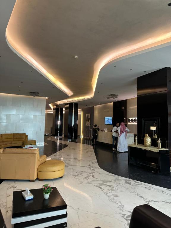 a lobby of a hotel with people standing in the lobby at شقة بإطلالة على البحر في برج داماك in Jeddah