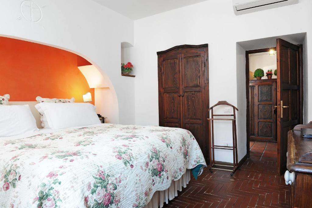 Postel nebo postele na pokoji v ubytování Hotel Lucrezia