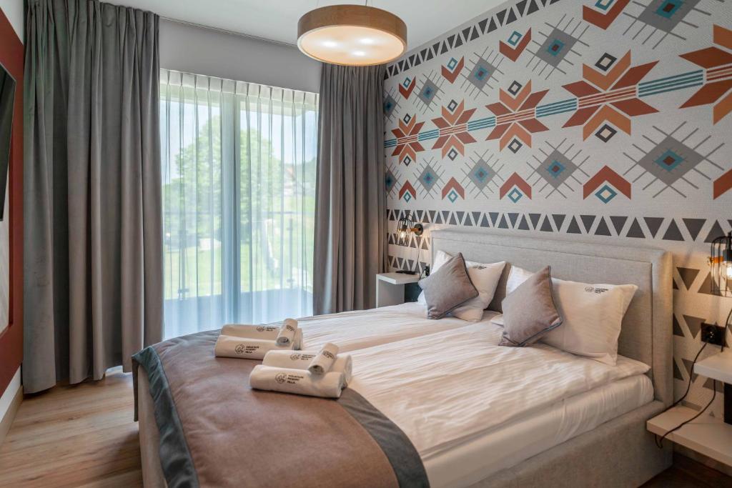 Posteľ alebo postele v izbe v ubytovaní Apartamenty Pod Gondolą - Mountain Resort Villa z sauną - Dream Apart