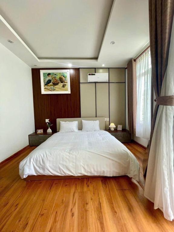 Postel nebo postele na pokoji v ubytování Minh Anh Villa & Apartment
