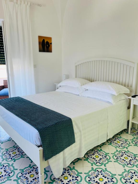 Lova arba lovos apgyvendinimo įstaigoje B&B L'Agapanto