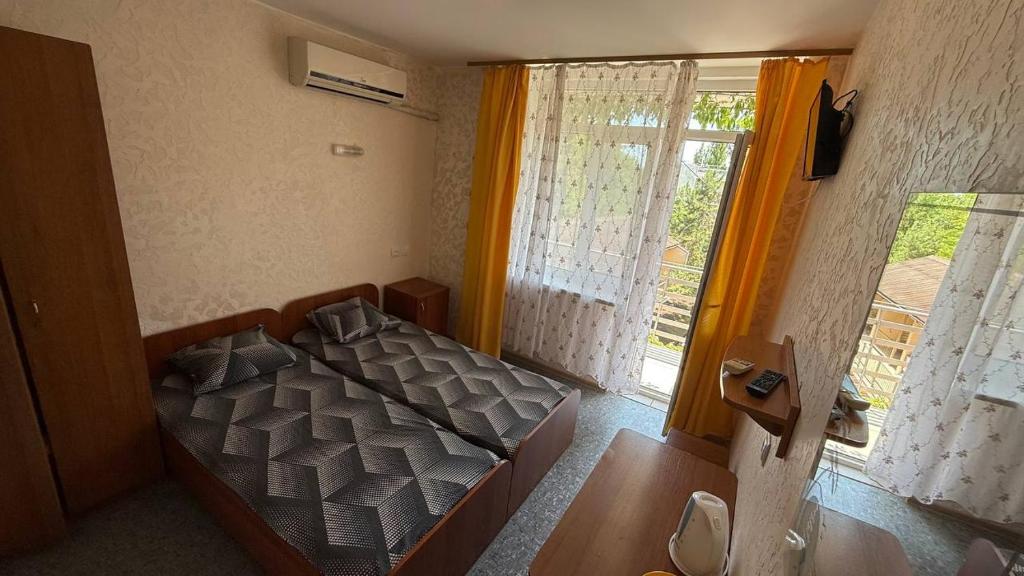 Postel nebo postele na pokoji v ubytování Ассоль
