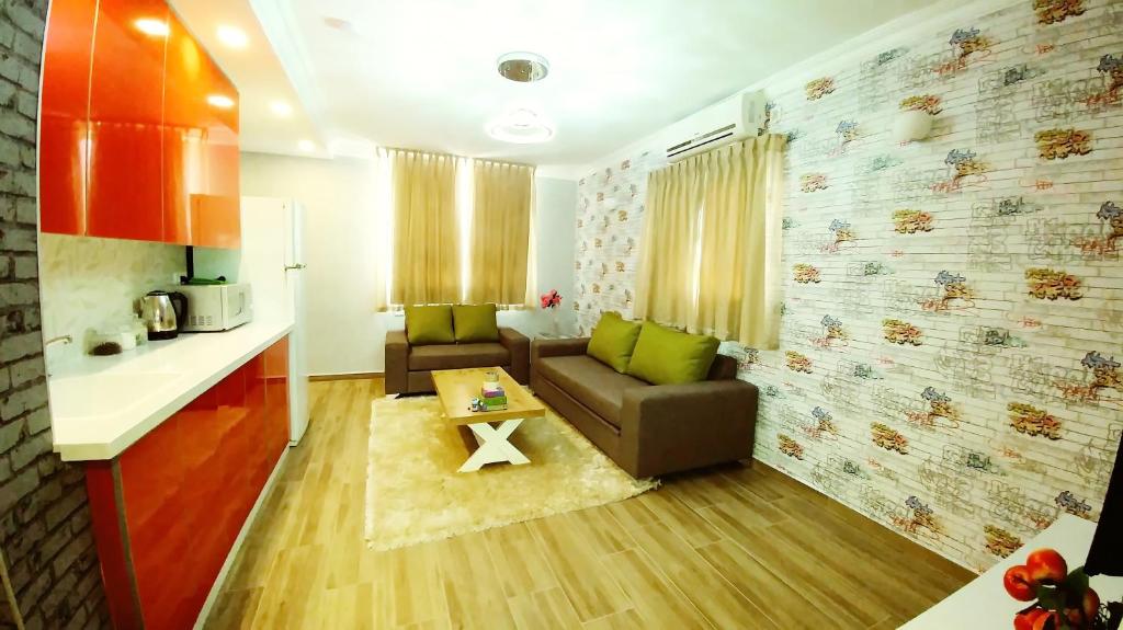 a living room with a couch and a table at City Apartments in Eilat